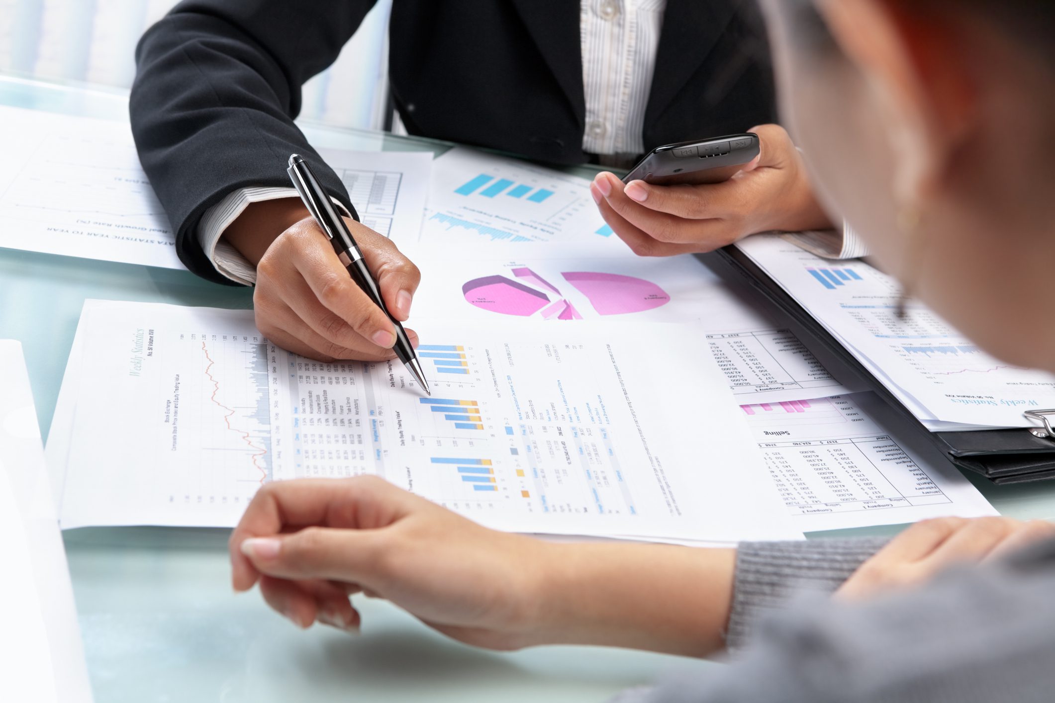 Asian Businesswomen working and analyzing data and statistic